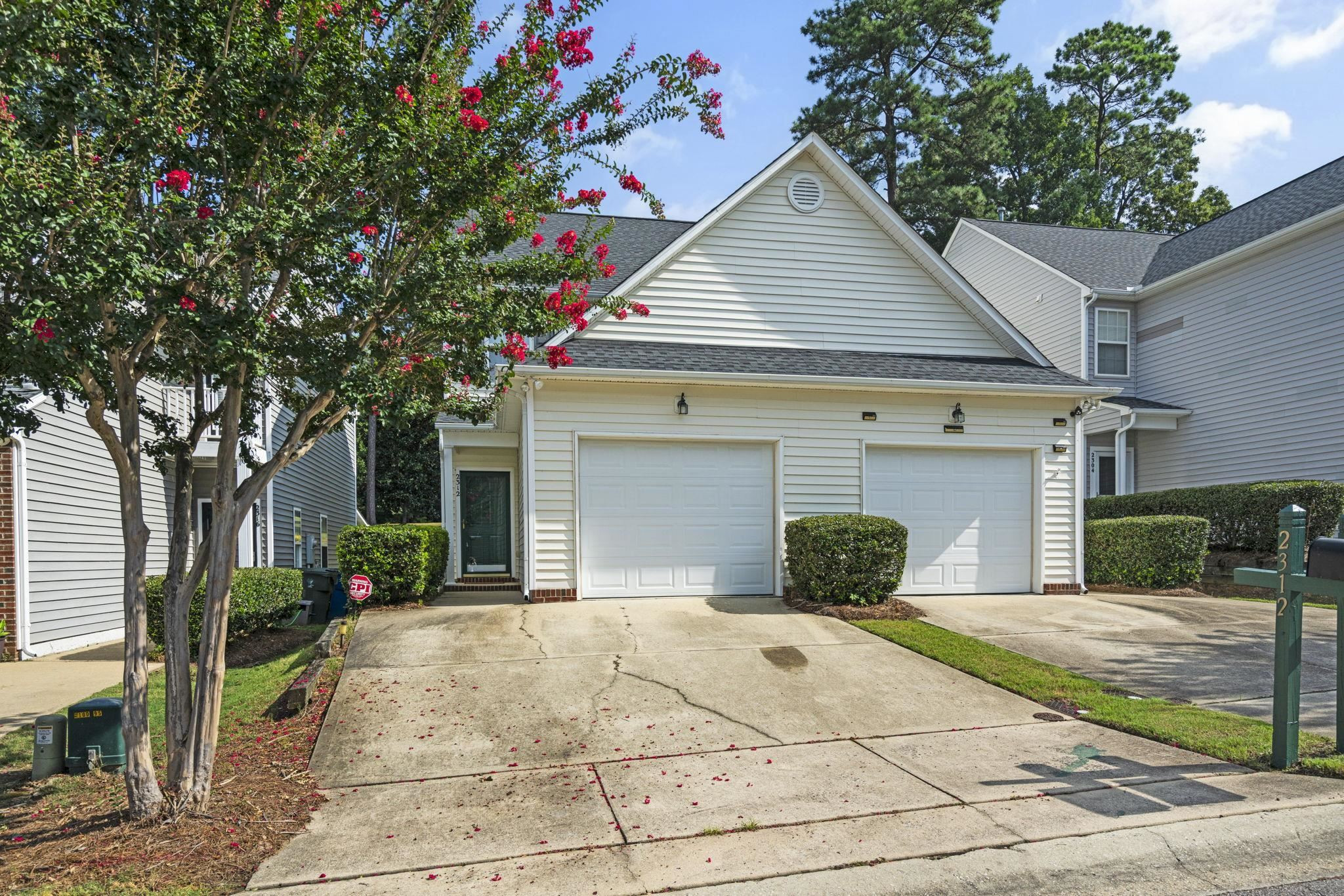 2312 Persimmon Ridge Drive Raleigh, NC 27604 - Photo 1 of 34 a view of a house with a yard and potted plants