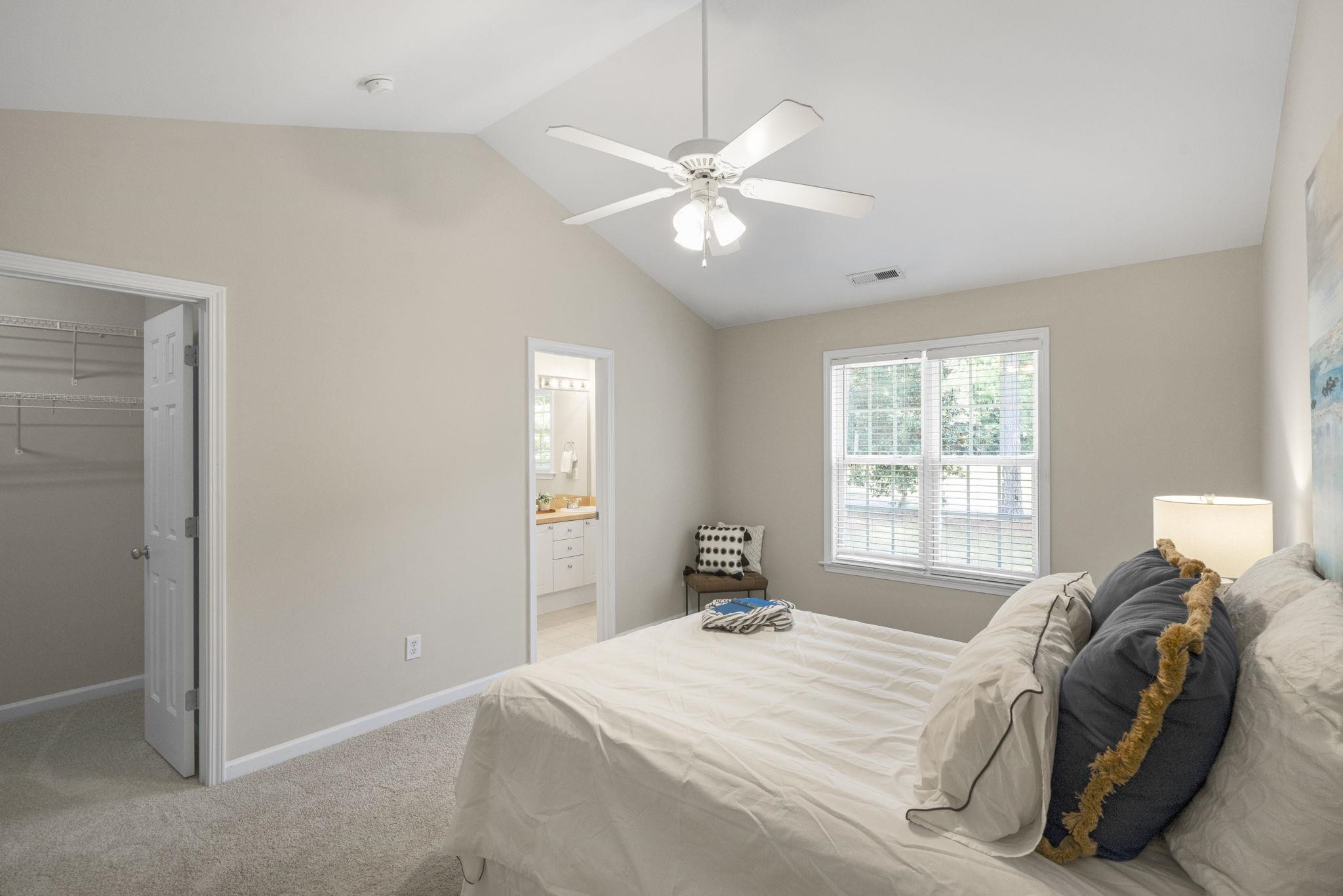 2312 Persimmon Ridge Drive Raleigh, NC 27604 - Photo 20 of 34 a bedroom with a bed and a window