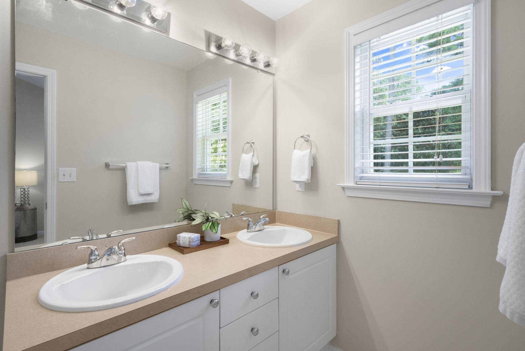 2312 Persimmon Ridge Drive Raleigh, NC 27604 - Photo 21 of 34 a bathroom with a sink double vanity granite and a mirror