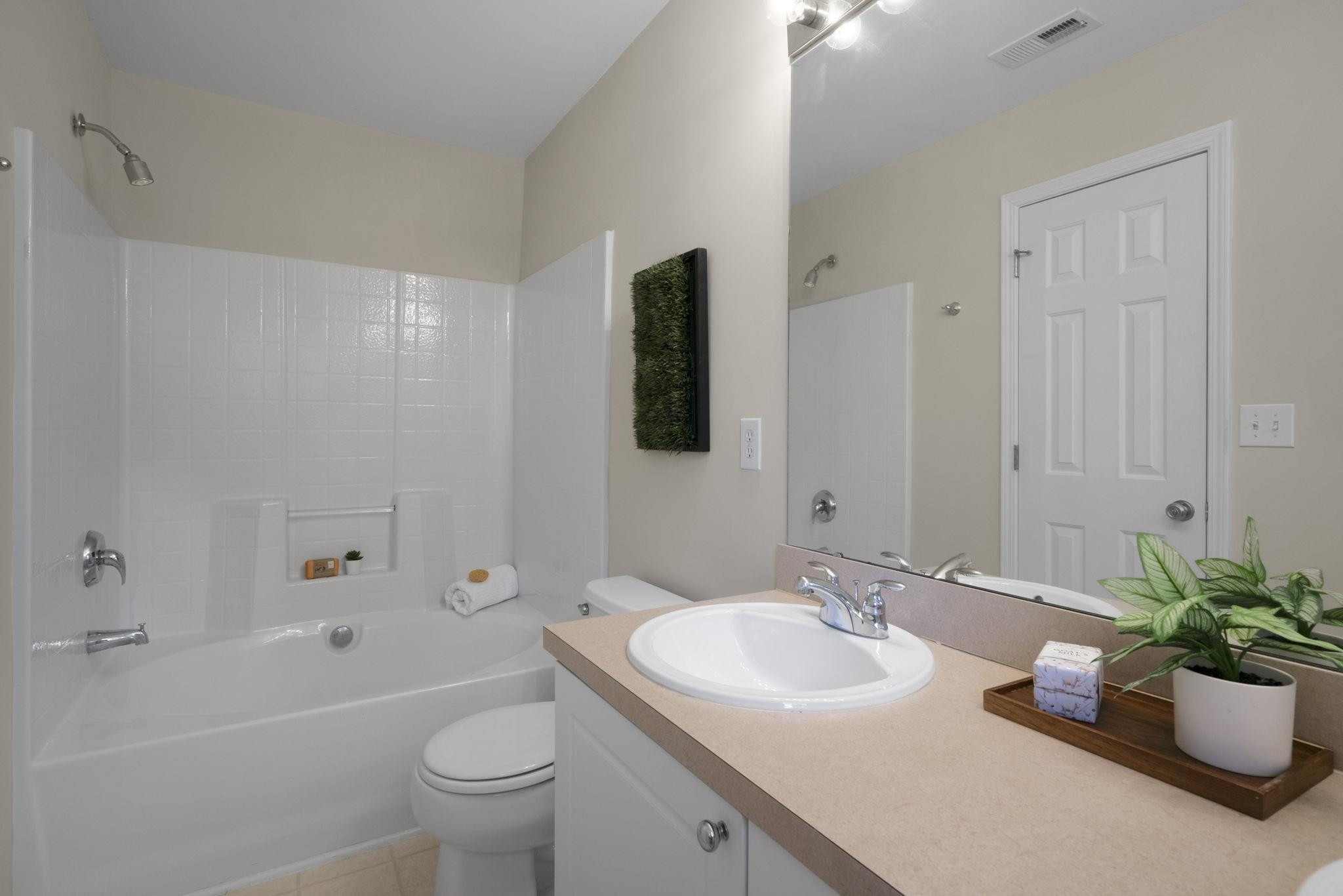 2312 Persimmon Ridge Drive Raleigh, NC 27604 - Photo 22 of 34 a bathroom with a granite countertop sink a toilet and shower