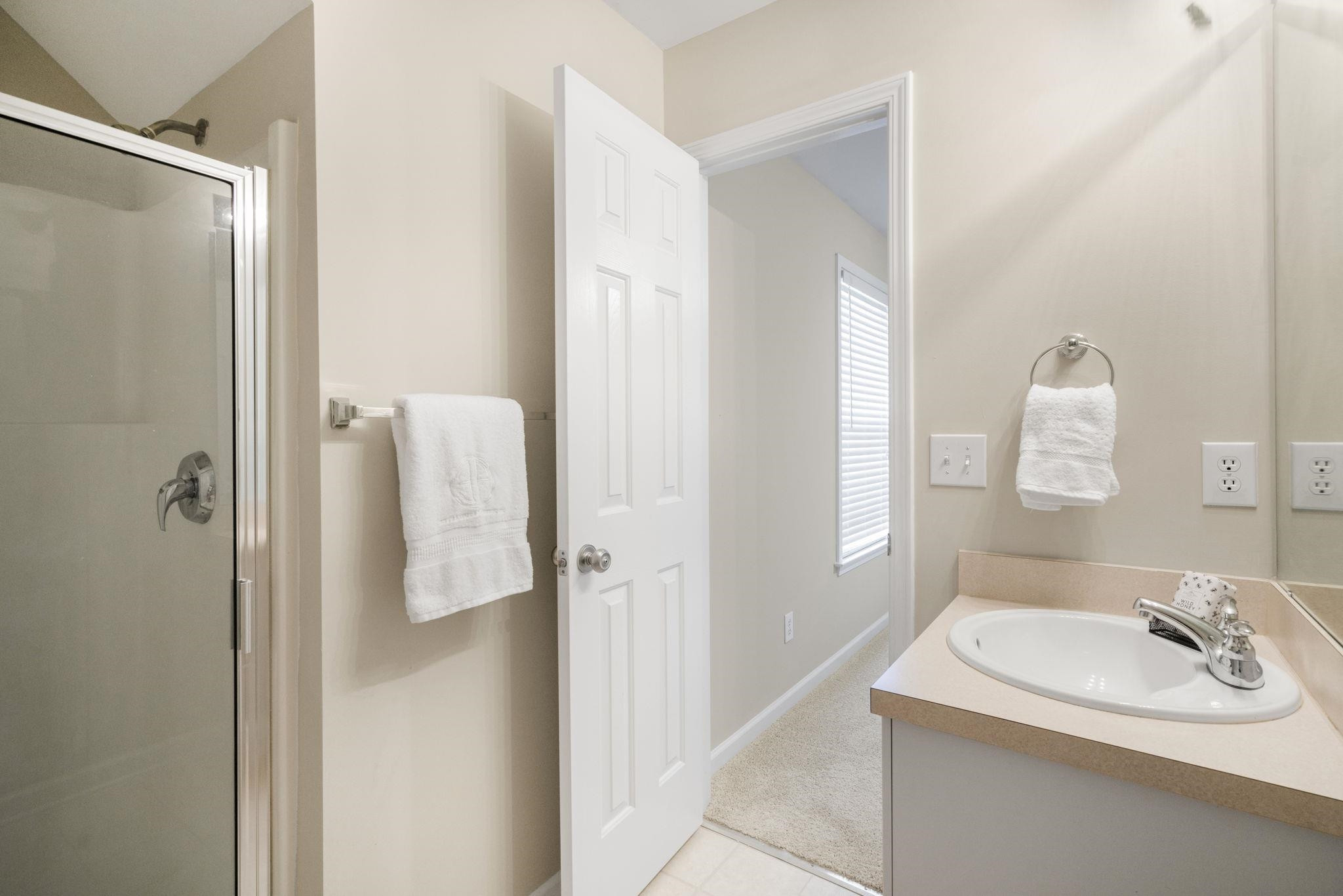 2312 Persimmon Ridge Drive Raleigh, NC 27604 - Photo 27 of 34 a bathroom with a sink and a mirror