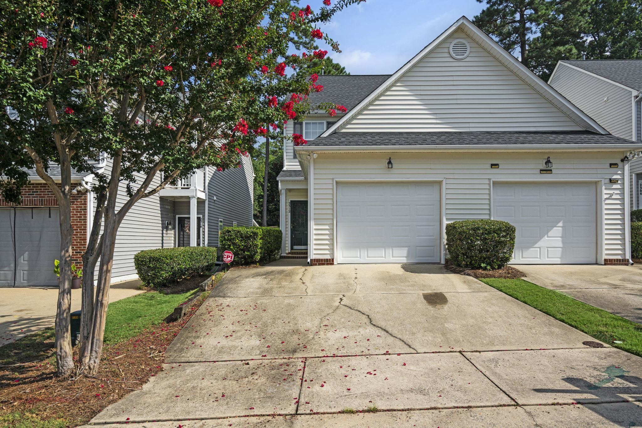 2312 Persimmon Ridge Drive Raleigh, NC 27604 - Photo 3 of 34 a front view of a house with garden