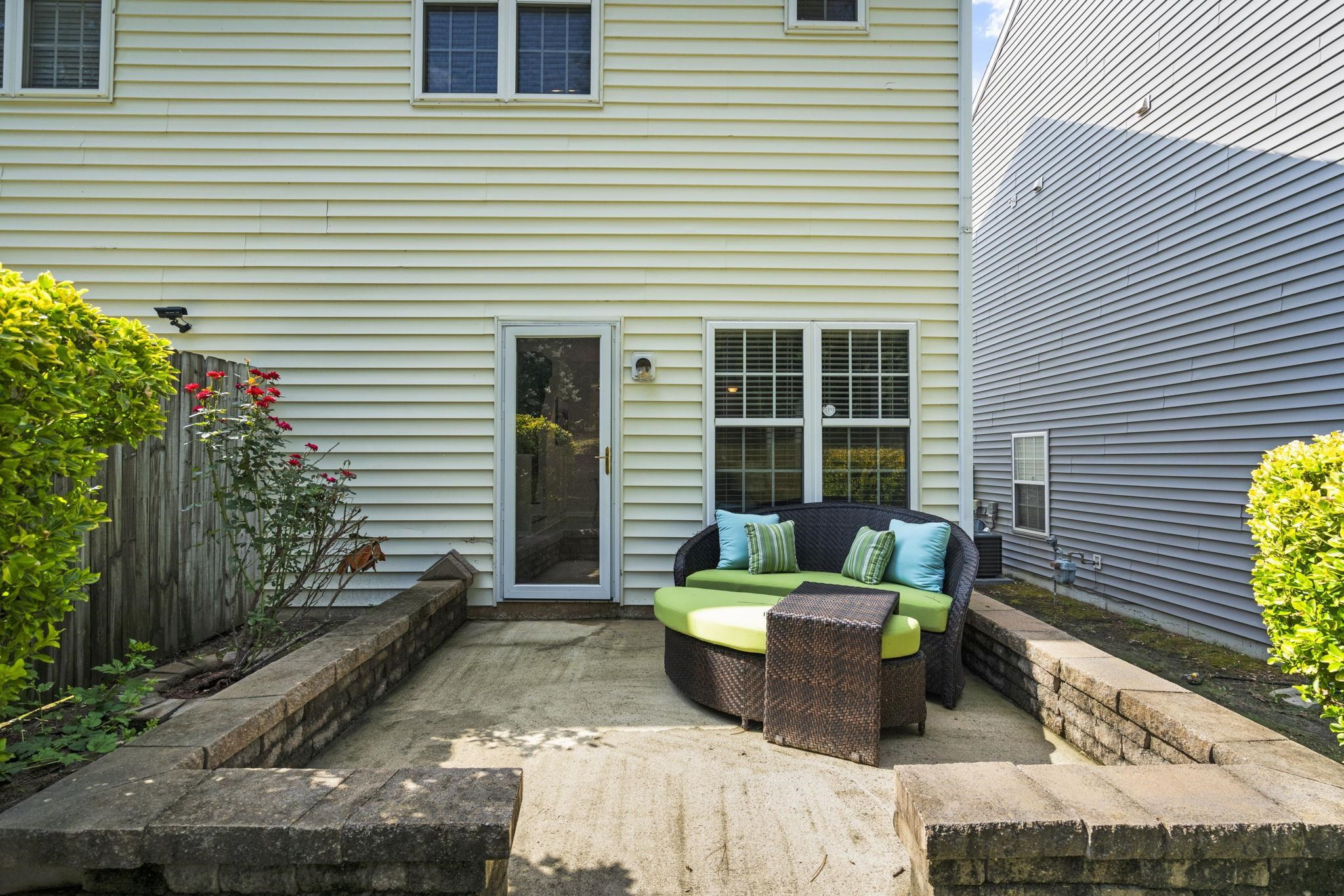 2312 Persimmon Ridge Drive Raleigh, NC 27604 - Photo 32 of 34 a view of a chair and tables in patio