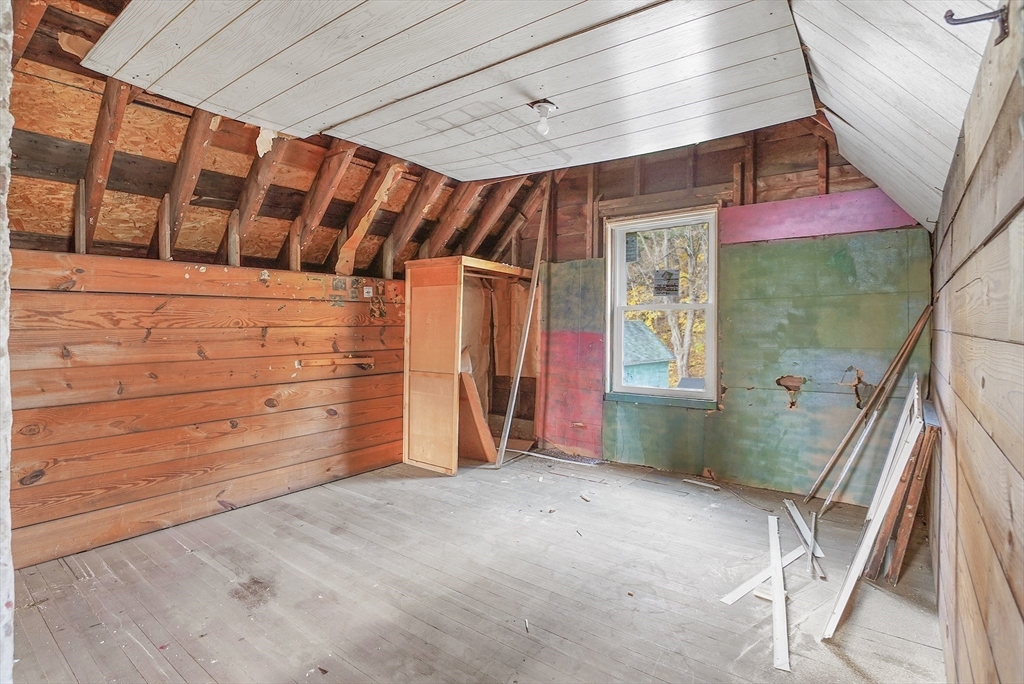 12 Temple Street Holyoke, MA 01040 - Photo 29 of 36 a view of an empty room with wooden stairs