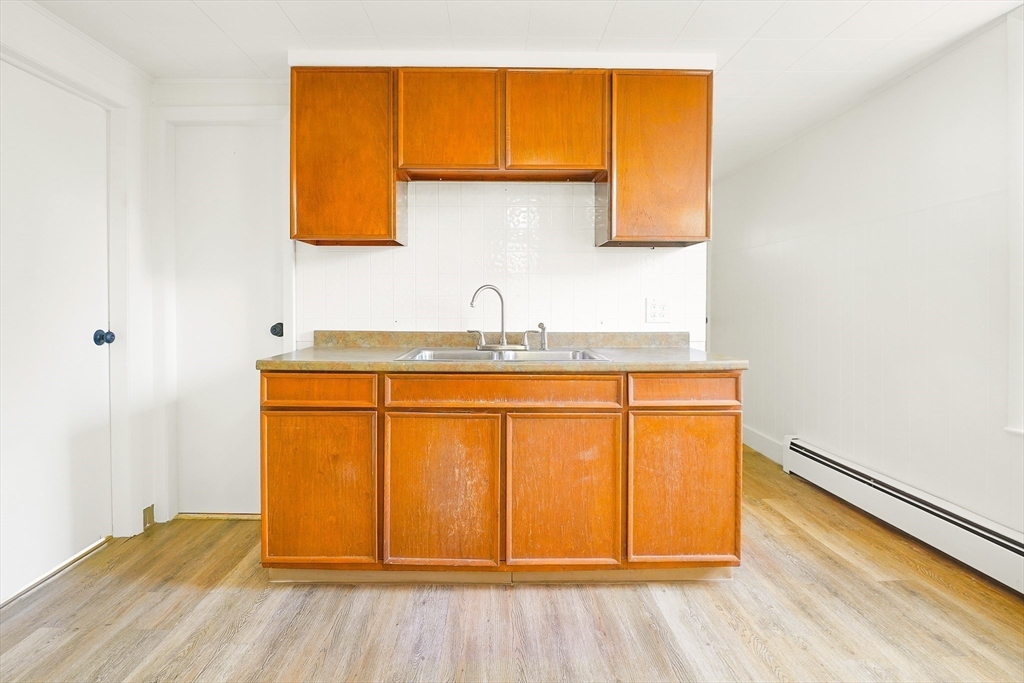 12 Temple Street Holyoke, MA 01040 - Photo 7 of 36 a bathroom with a sink and a mirror