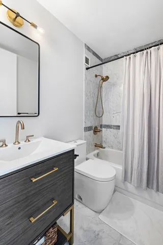 a very nice looking living room with a large window and wooden floor