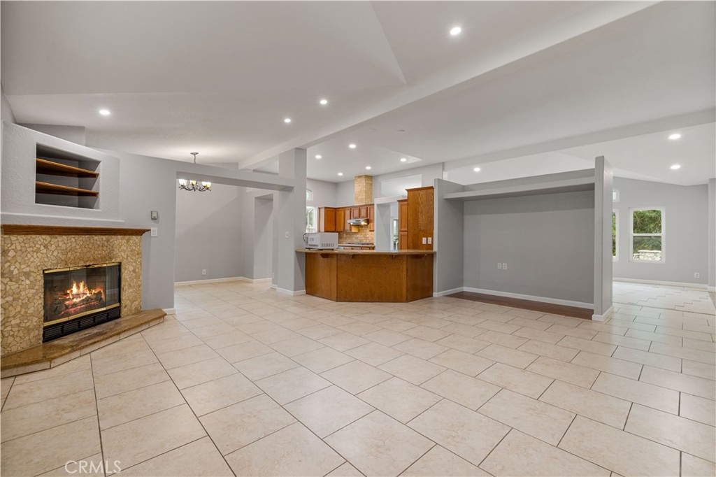15608 Tierra Rejada Road Moorpark, CA 93021 - Photo 12 of 34 a view of a kitchen with a sink and a fireplace