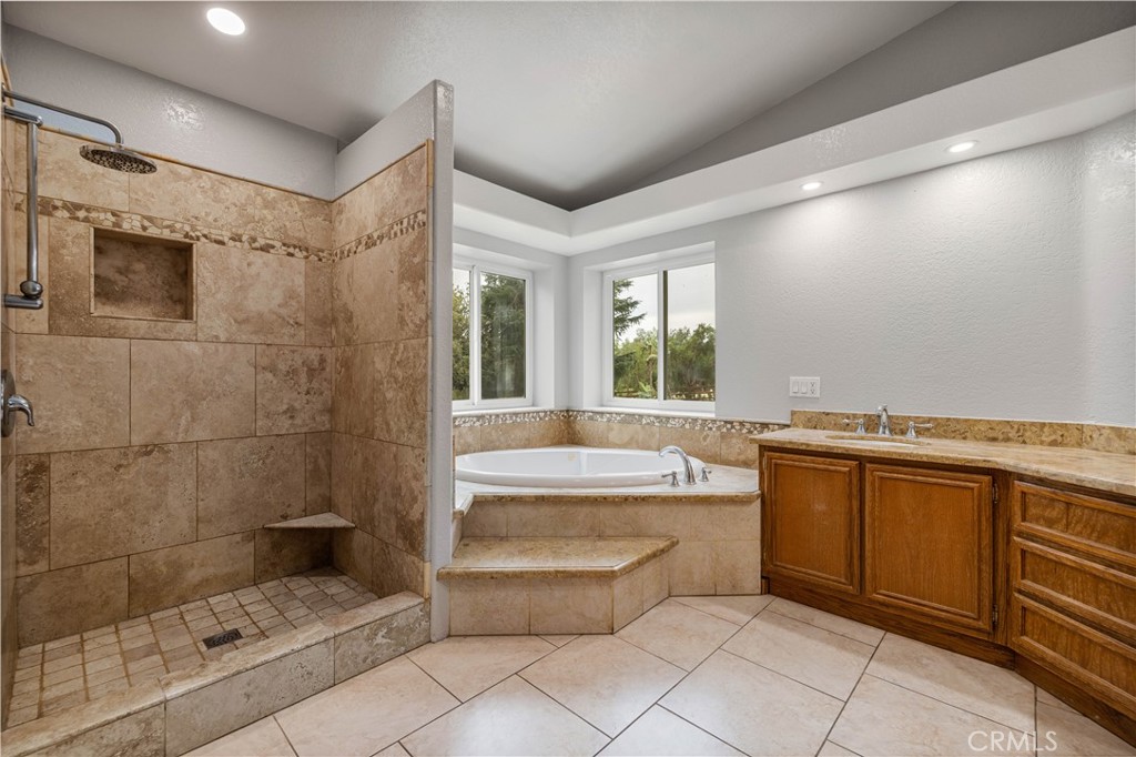 15608 Tierra Rejada Road Moorpark, CA 93021 - Photo 22 of 34 a bathroom with a bathtub and a sink