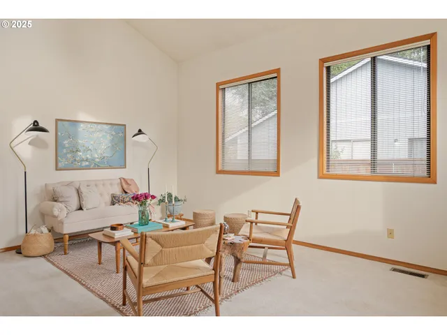 a living room with furniture and a table