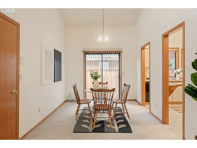a kitchen with stainless steel appliances granite countertop a sink and a refrigerator