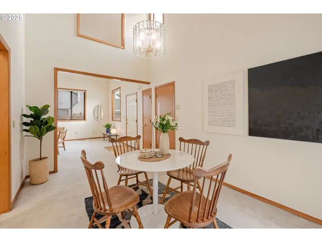 a view of a dining room with furniture and a table