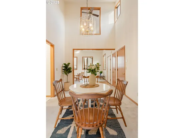 a view of a livingroom with furniture and a potted plant