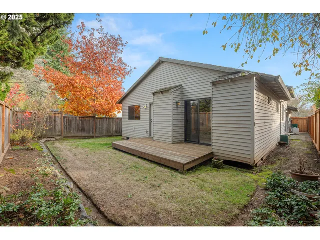 a living room with furniture a desk and chair