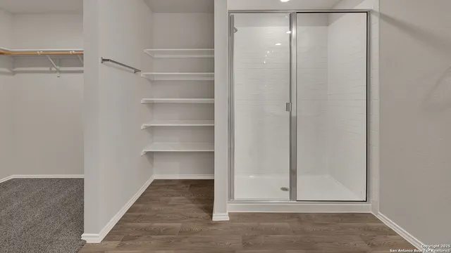 a view of an empty walk in closet