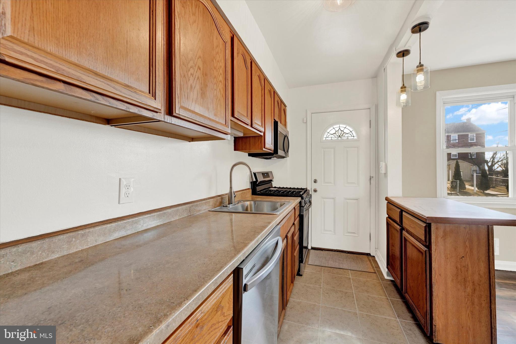 7007 Bank Street Baltimore, MD 21224 - Photo 3 of 17 a kitchen with a sink and cabinets