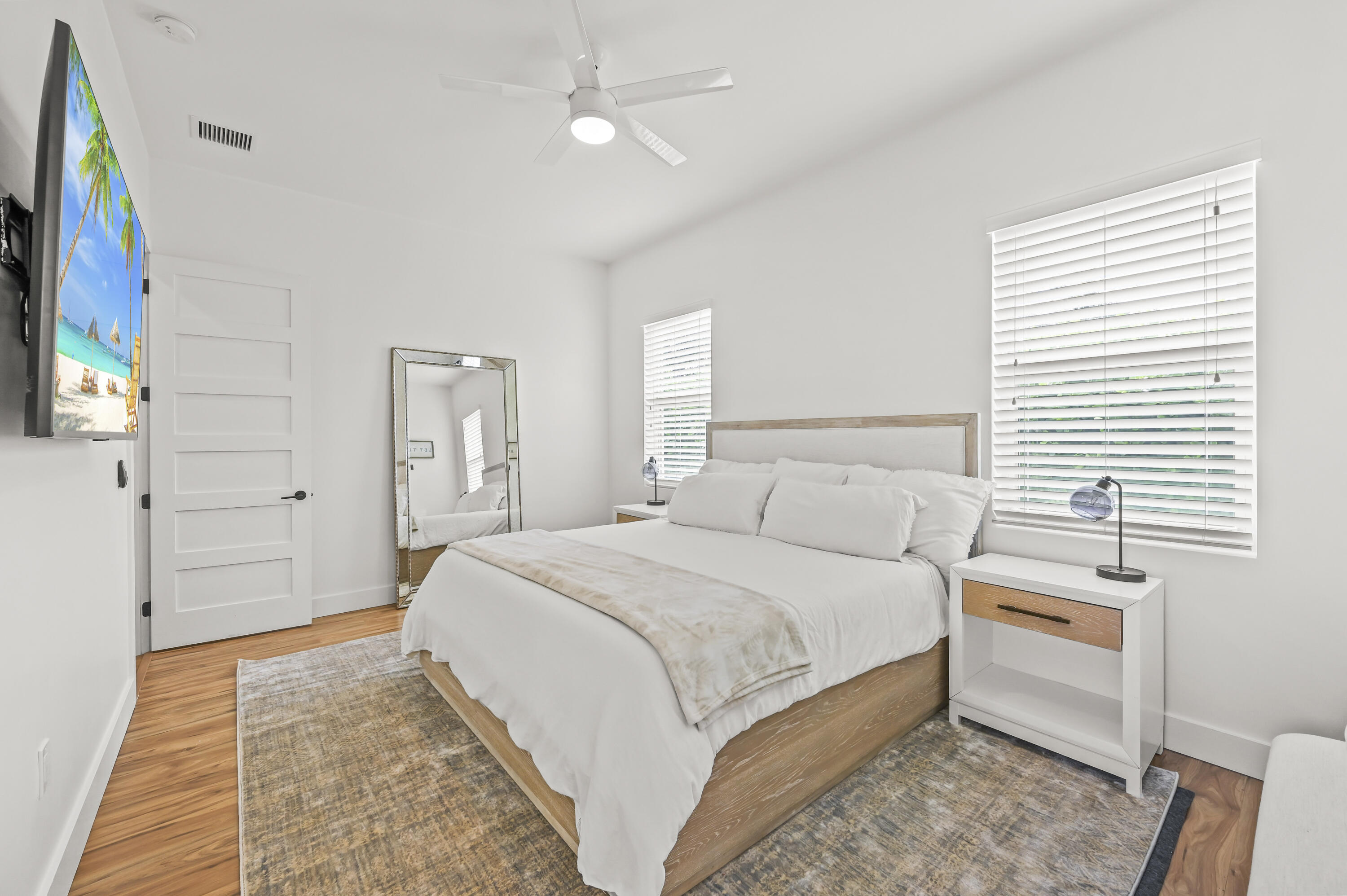 68 Azalea Circle Tequesta, FL 33469 - Photo 14 of 36 a bedroom with a bed and a flat screen tv