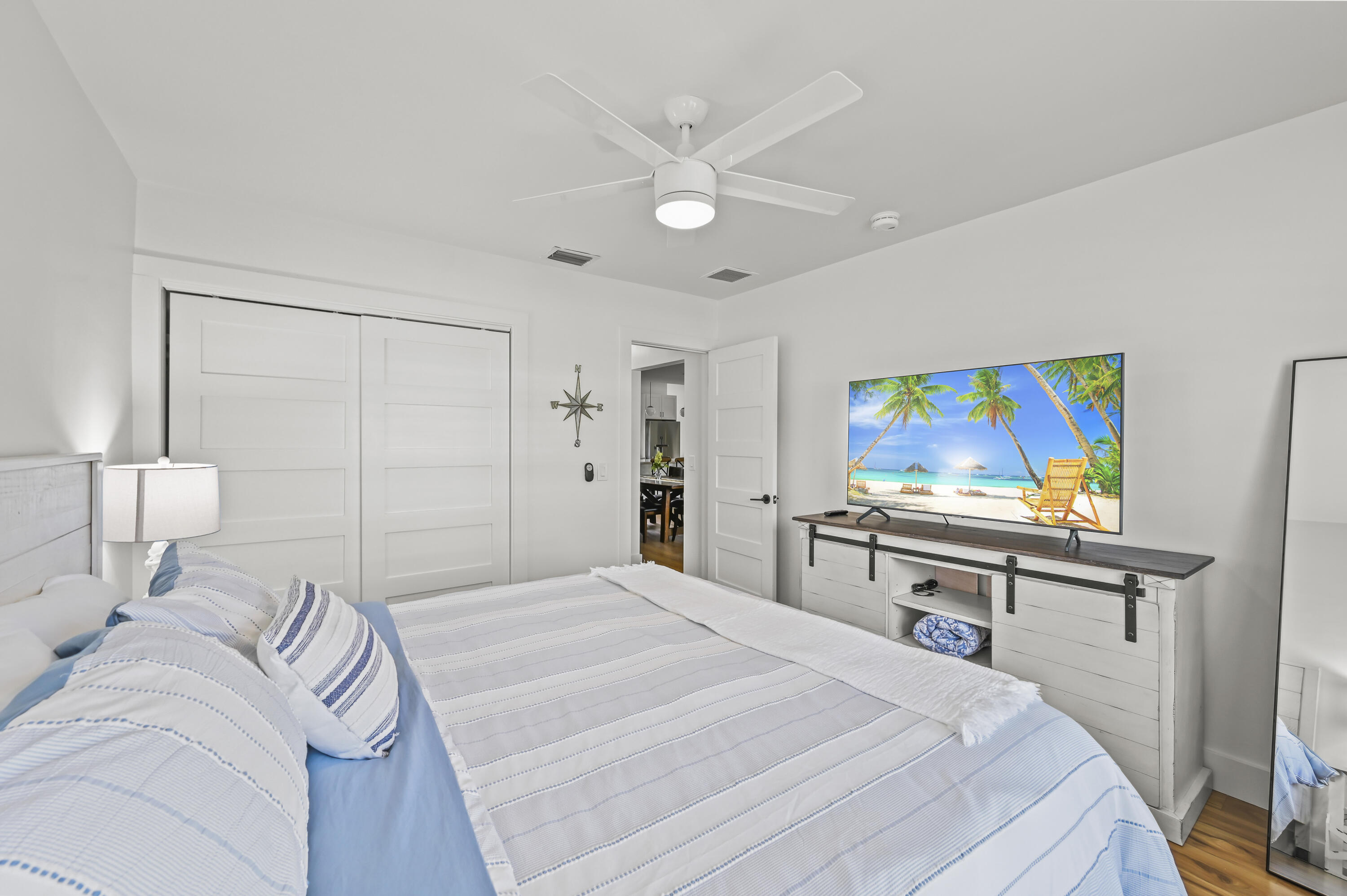 68 Azalea Circle Tequesta, FL 33469 - Photo 19 of 36 a bedroom with a bed and a desk