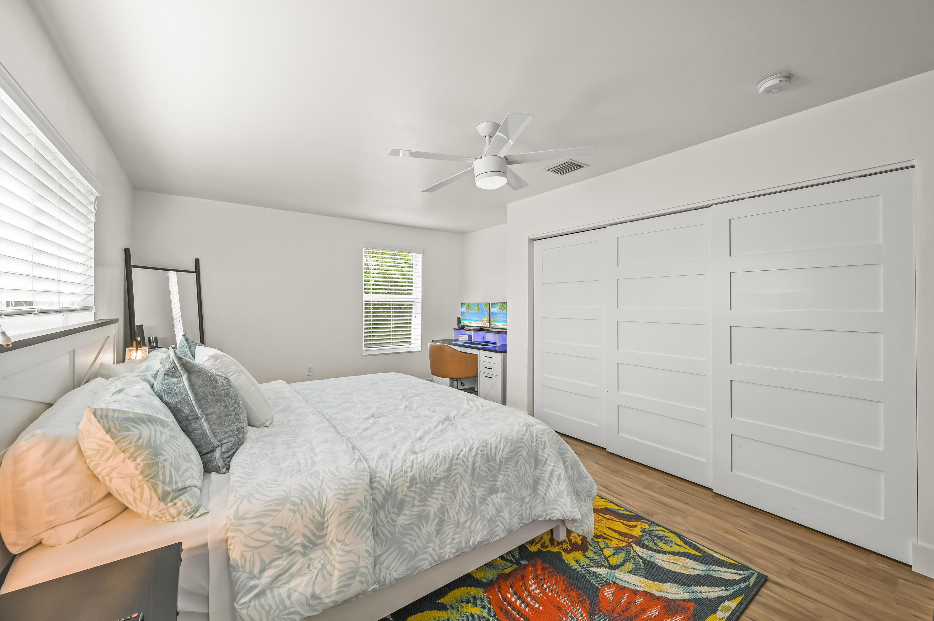 68 Azalea Circle Tequesta, FL 33469 - Photo 22 of 36 a bed room with a bed and a chandelier