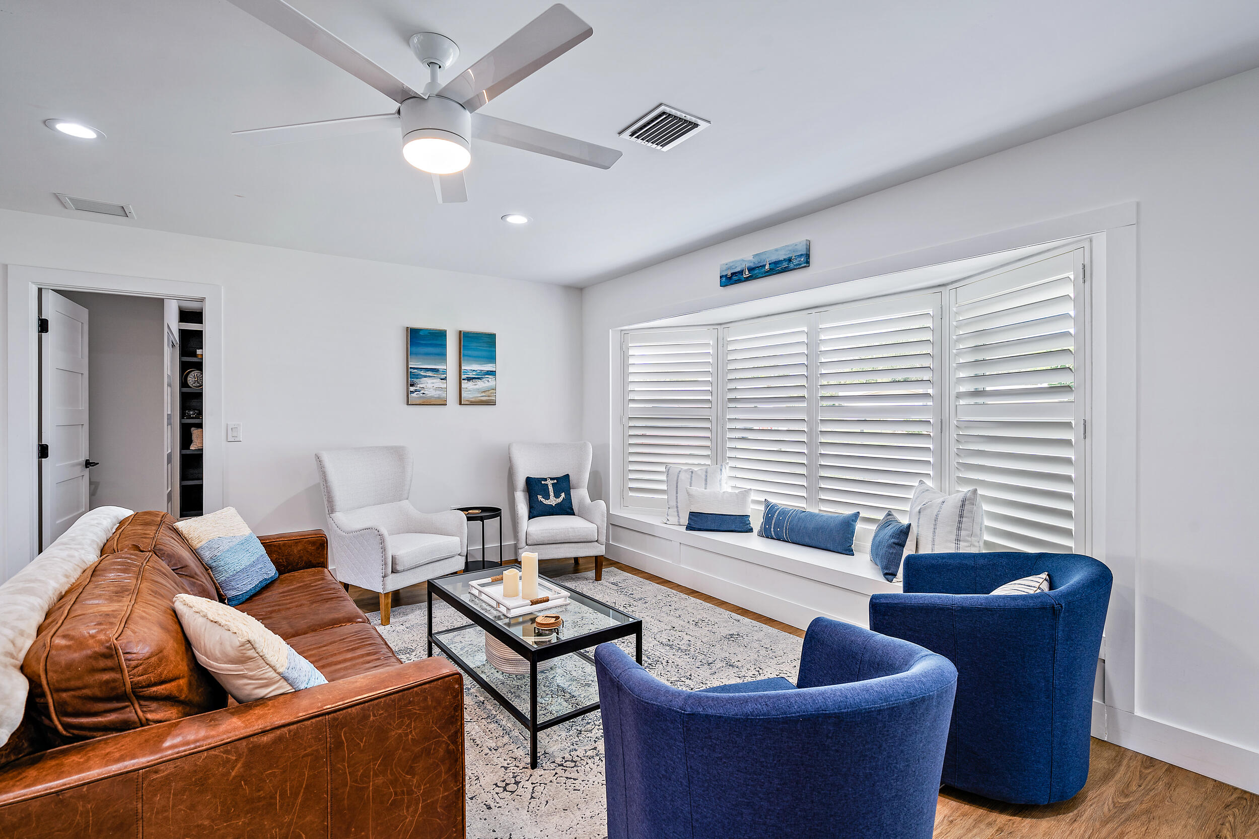 68 Azalea Circle Tequesta, FL 33469 - Photo 3 of 36 a living room with furniture and a large window