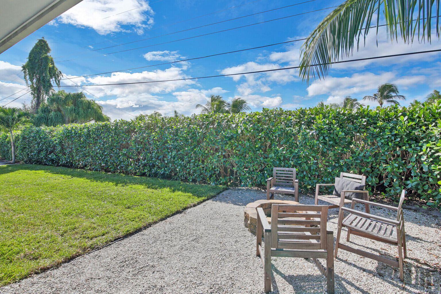 68 Azalea Circle Tequesta, FL 33469 - Photo 31 of 36 a view of a chairs and table in the patio