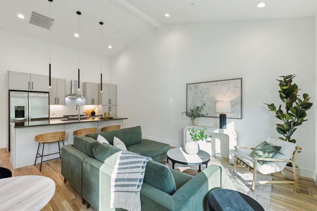 a living room with furniture and a table