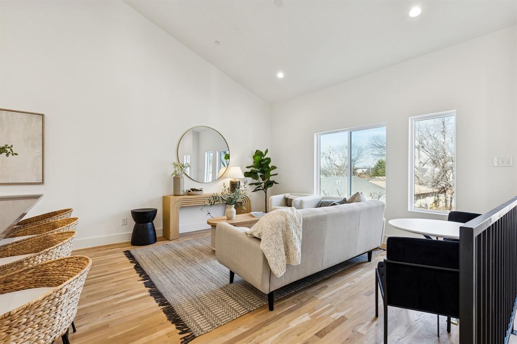 2142 Lovedale Avenue, Unit 104 Dallas, TX 75235 - Photo 14 of 29 a living room with furniture a table and large windows