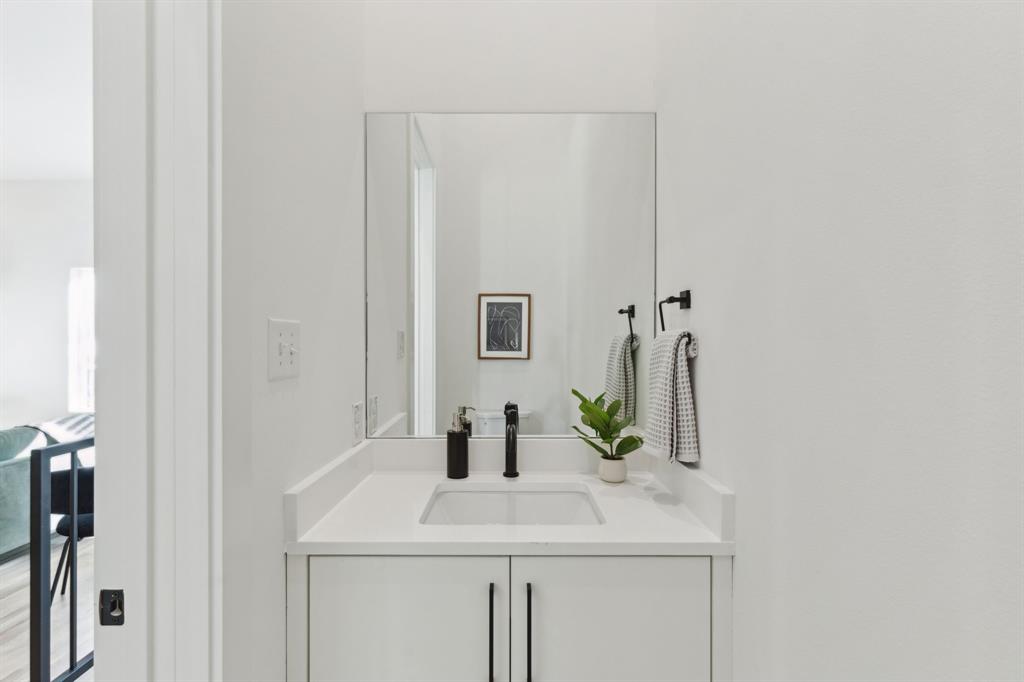 2142 Lovedale Avenue, Unit 104 Dallas, TX 75235 - Photo 15 of 29 a bathroom with a sink and a mirror