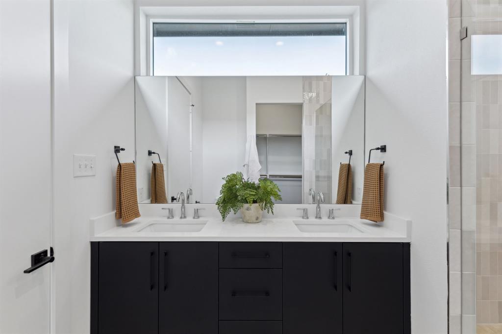 2142 Lovedale Avenue, Unit 104 Dallas, TX 75235 - Photo 22 of 29 a bathroom with a sink and a mirror