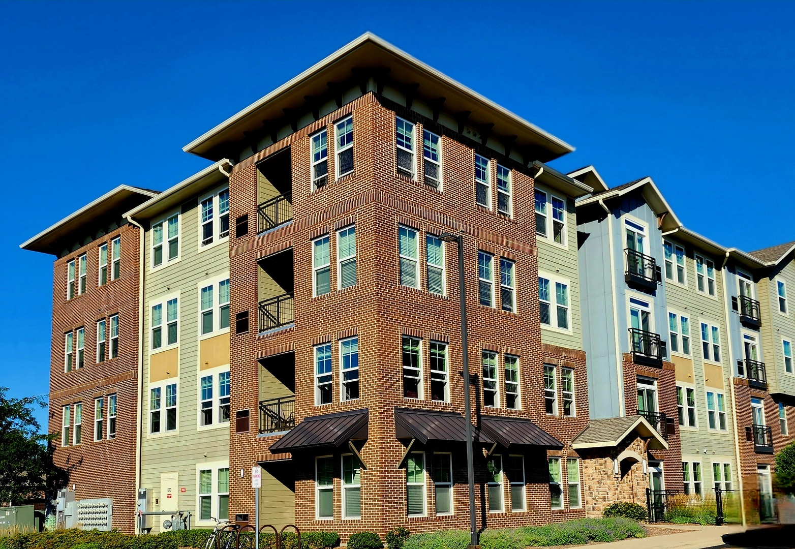 670 East Algonquin Road, Unit 4308 Schaumburg, IL 60173 - Photo 1 of 29 a front view of a building with a yard