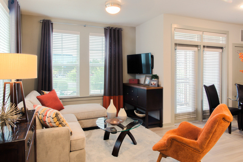 670 East Algonquin Road, Unit 4308 Schaumburg, IL 60173 - Photo 7 of 29 a living room with furniture and a flat screen tv