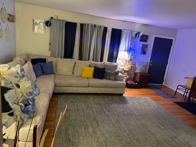 a living room with furniture and a yard