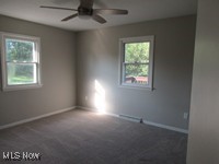 6439 Wadsworth Road Medina, OH 44256 - Photo 10 of 14 Unfurnished room featuring plenty of natural light, carpet flooring, and ceiling fan