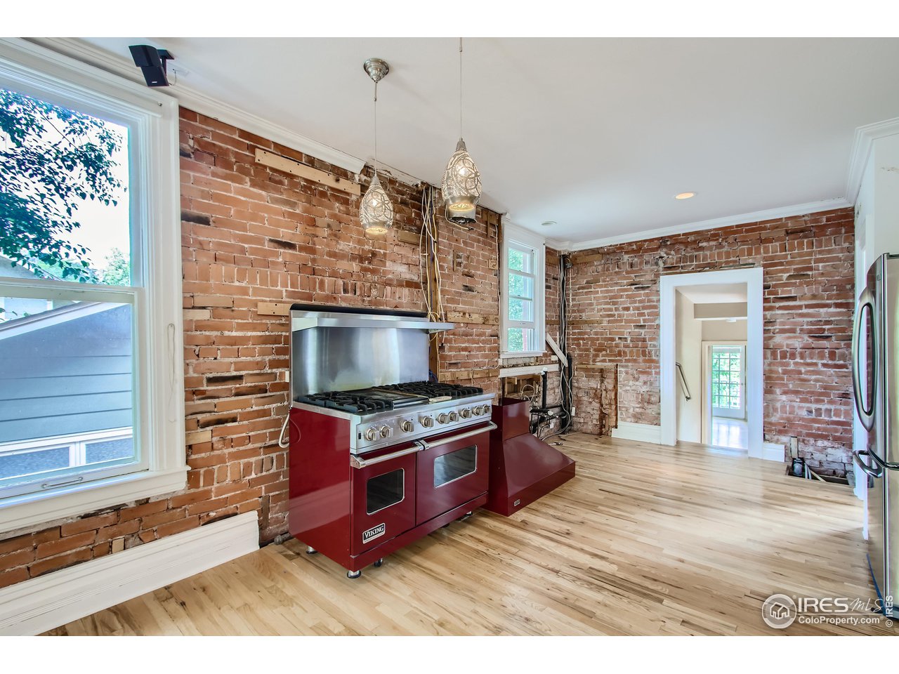 417 Mapleton Avenue, Unit B Boulder, CO 80304 - Photo 12 of 27 a living room with furniture flat screen tv and a fireplace