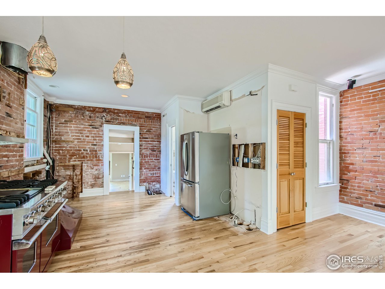 417 Mapleton Avenue, Unit B Boulder, CO 80304 - Photo 13 of 27 a open kitchen with refrigerator stove and wooden floor