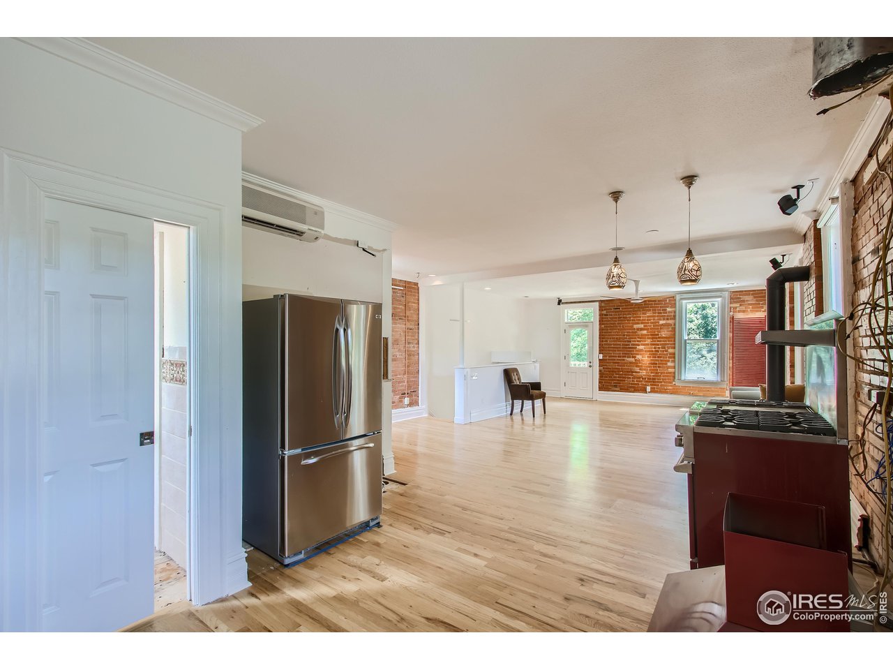 417 Mapleton Avenue, Unit B Boulder, CO 80304 - Photo 14 of 27 a view of a kitchen with refrigerator and wooden floor