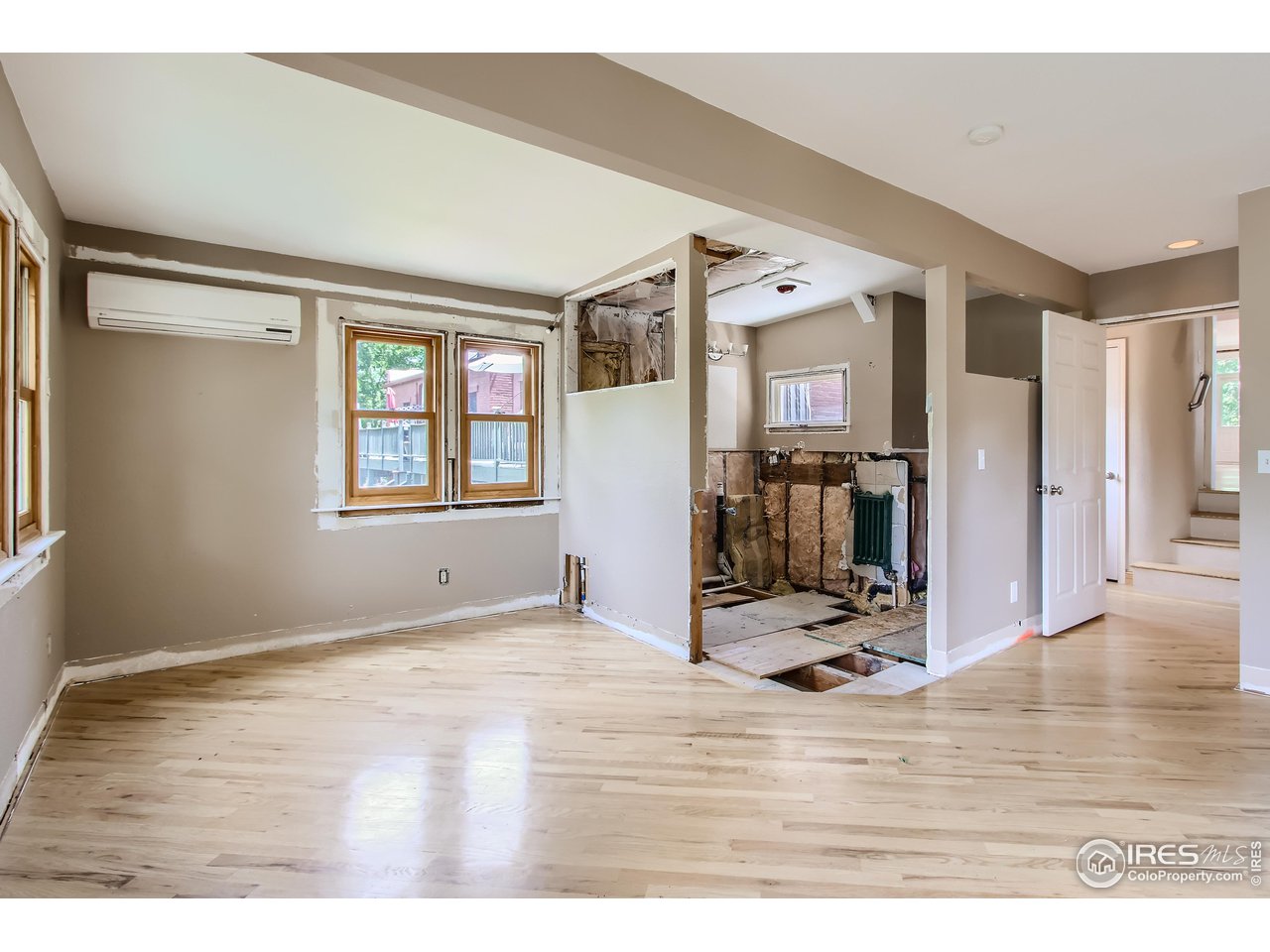 417 Mapleton Avenue, Unit B Boulder, CO 80304 - Photo 17 of 27 a view of a livingroom with wooden floor and furniture