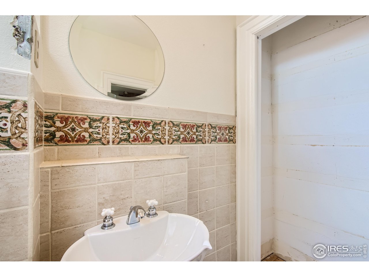 417 Mapleton Avenue, Unit B Boulder, CO 80304 - Photo 19 of 27 a bathroom with a sink and mirror