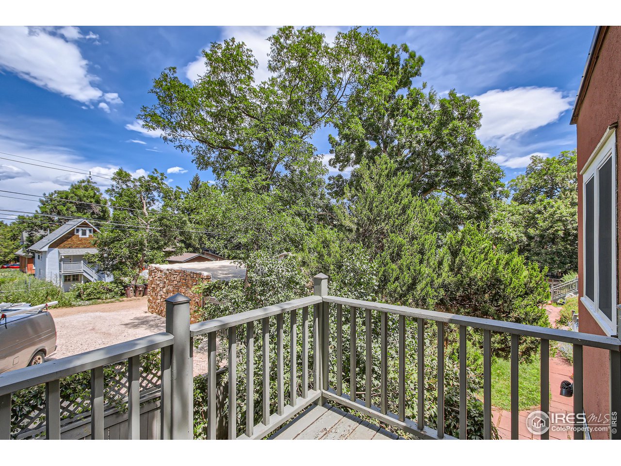 417 Mapleton Avenue, Unit B Boulder, CO 80304 - Photo 24 of 27 a view of a balcony with wooden floor and fence