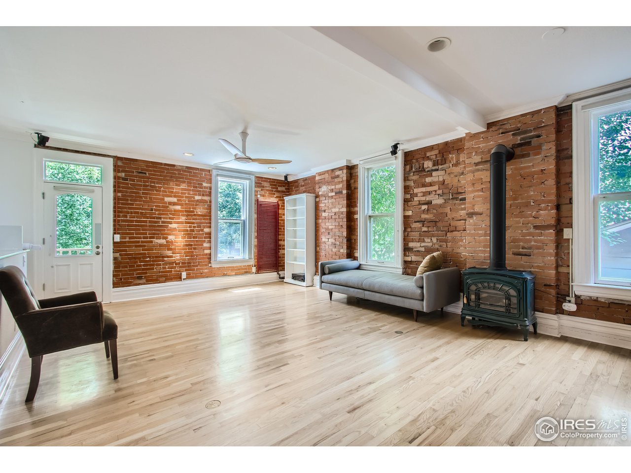 417 Mapleton Avenue, Unit B Boulder, CO 80304 - Photo 4 of 27 a living room with furniture and large windows