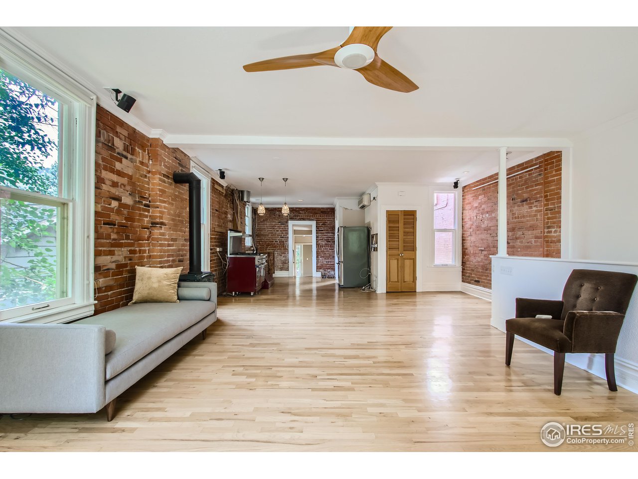 417 Mapleton Avenue, Unit B Boulder, CO 80304 - Photo 6 of 27 a living room with furniture and a large window