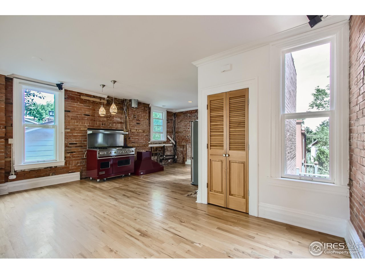 417 Mapleton Avenue, Unit B Boulder, CO 80304 - Photo 7 of 27 a living room with furniture and a window