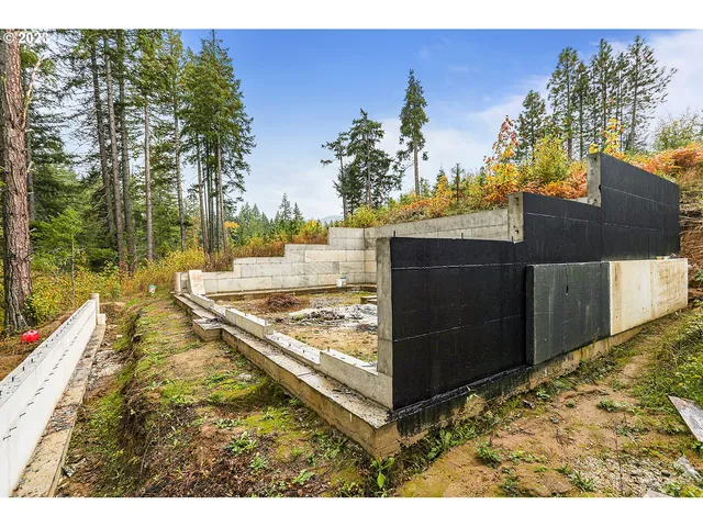 a backyard of a house with a yard and outdoor seating