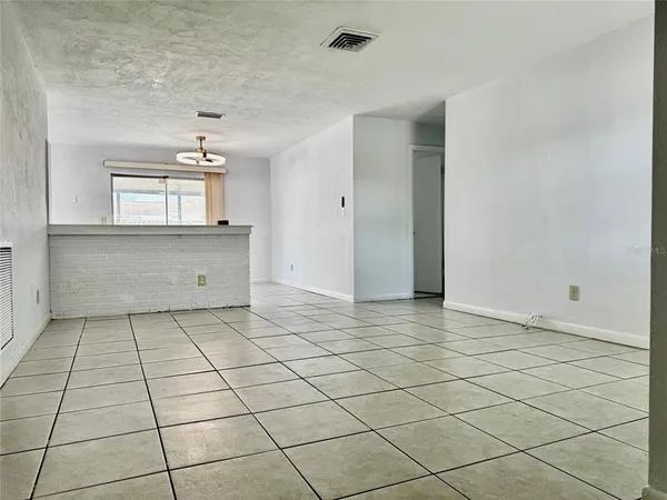 a view of a kitchen with a sink and cabinets