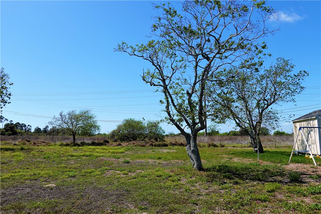 627 8th Street Ingleside, TX 78362 - Photo 9 of 14 a view of a garden with trees