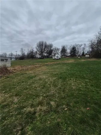 a view of a lake with houses in back
