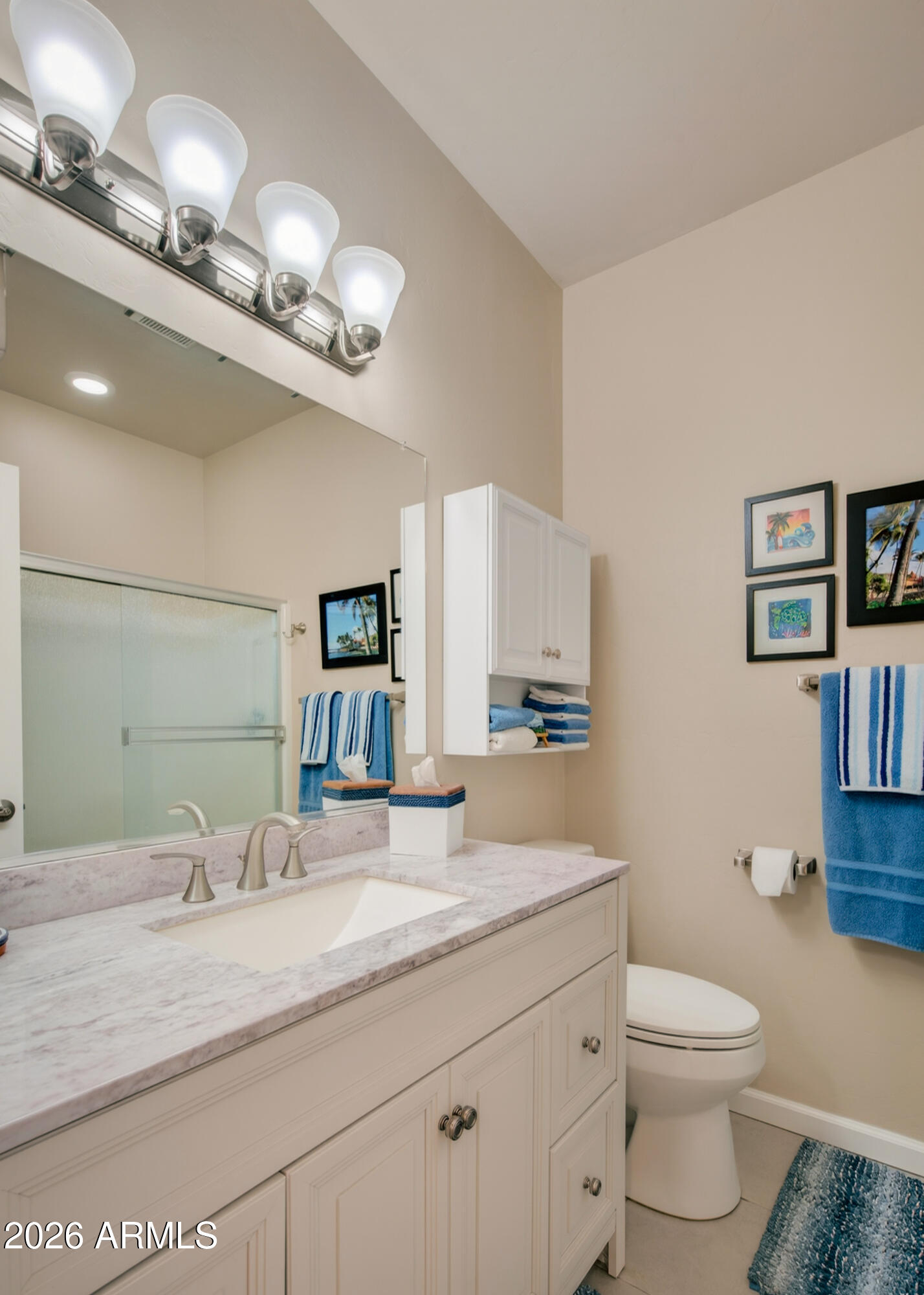 718 South Wandering River Road Cornville, AZ 86325 - Photo 29 of 41 a bathroom with a toilet a sink and a mirror