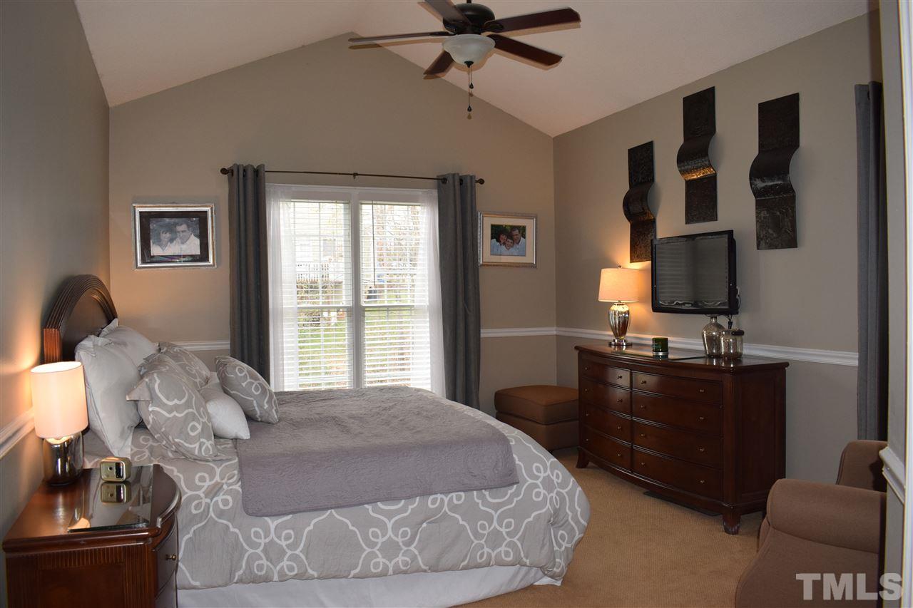 5200 Calverton Drive Raleigh, NC 27613 - Photo 12 of 25 First floor master bedroom with cathedral ceiling & ceiling fan.