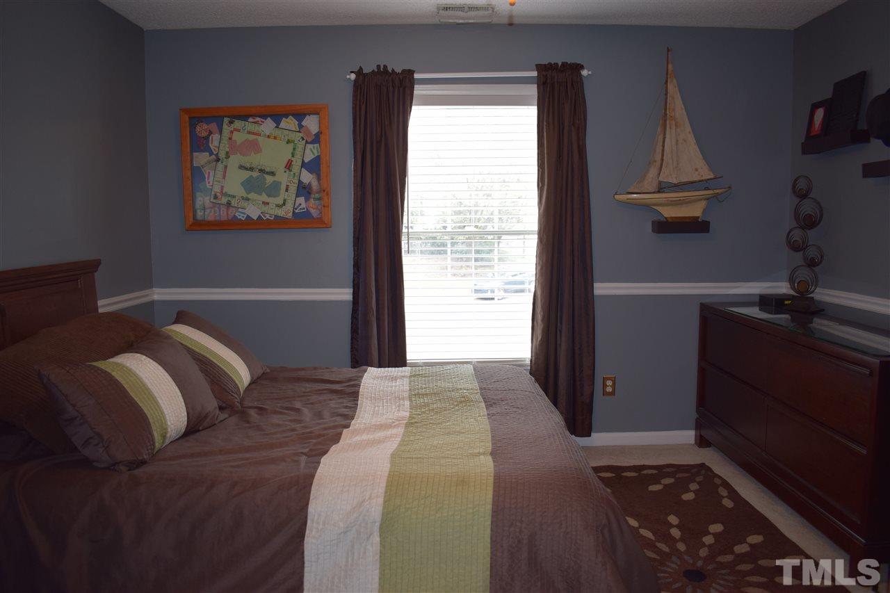 5200 Calverton Drive Raleigh, NC 27613 - Photo 15 of 25 Large second bedroom.