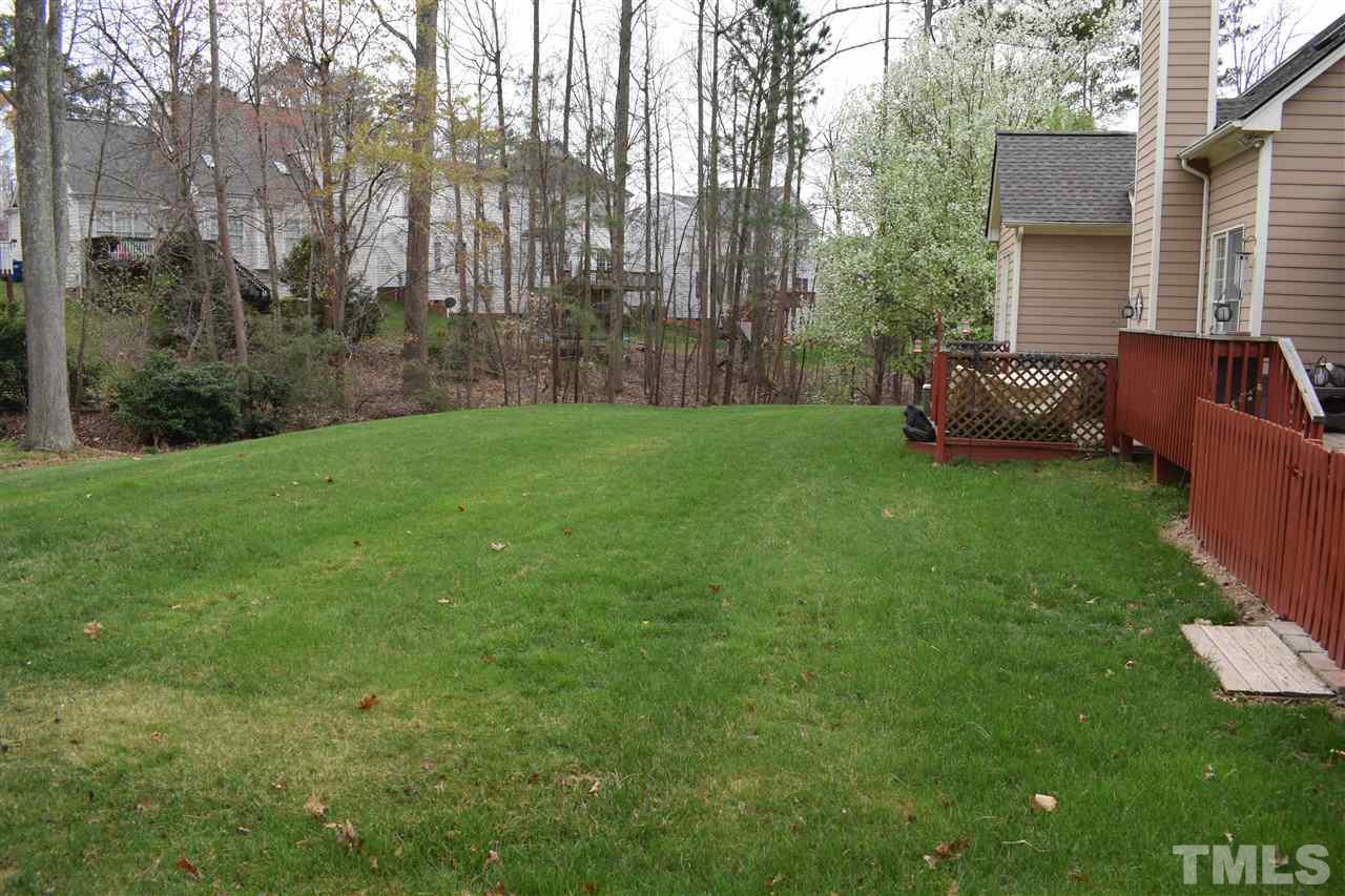 5200 Calverton Drive Raleigh, NC 27613 - Photo 22 of 25 Amazing back yard with plenty of room to run & play.