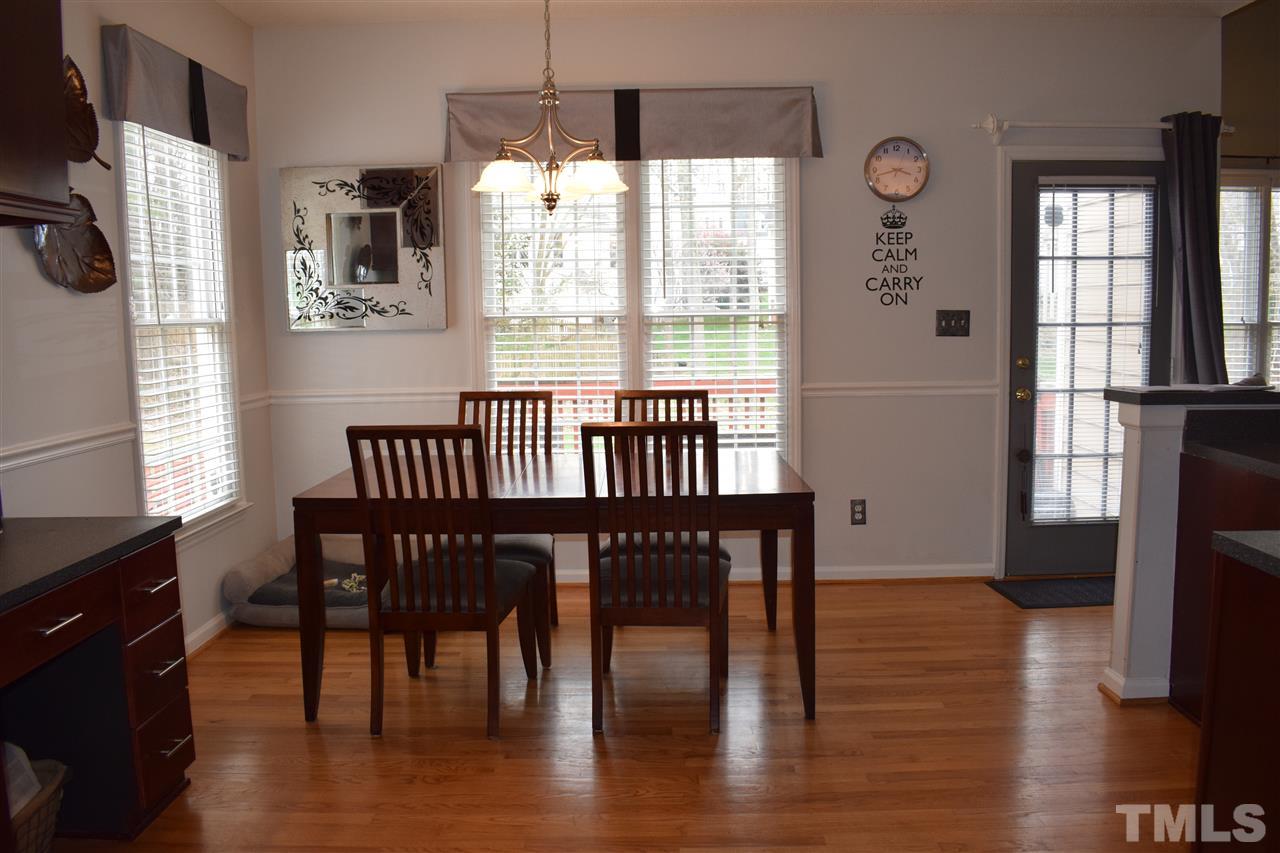 5200 Calverton Drive Raleigh, NC 27613 - Photo 5 of 25 Breakfast area overlooking deck & incredible back yard.